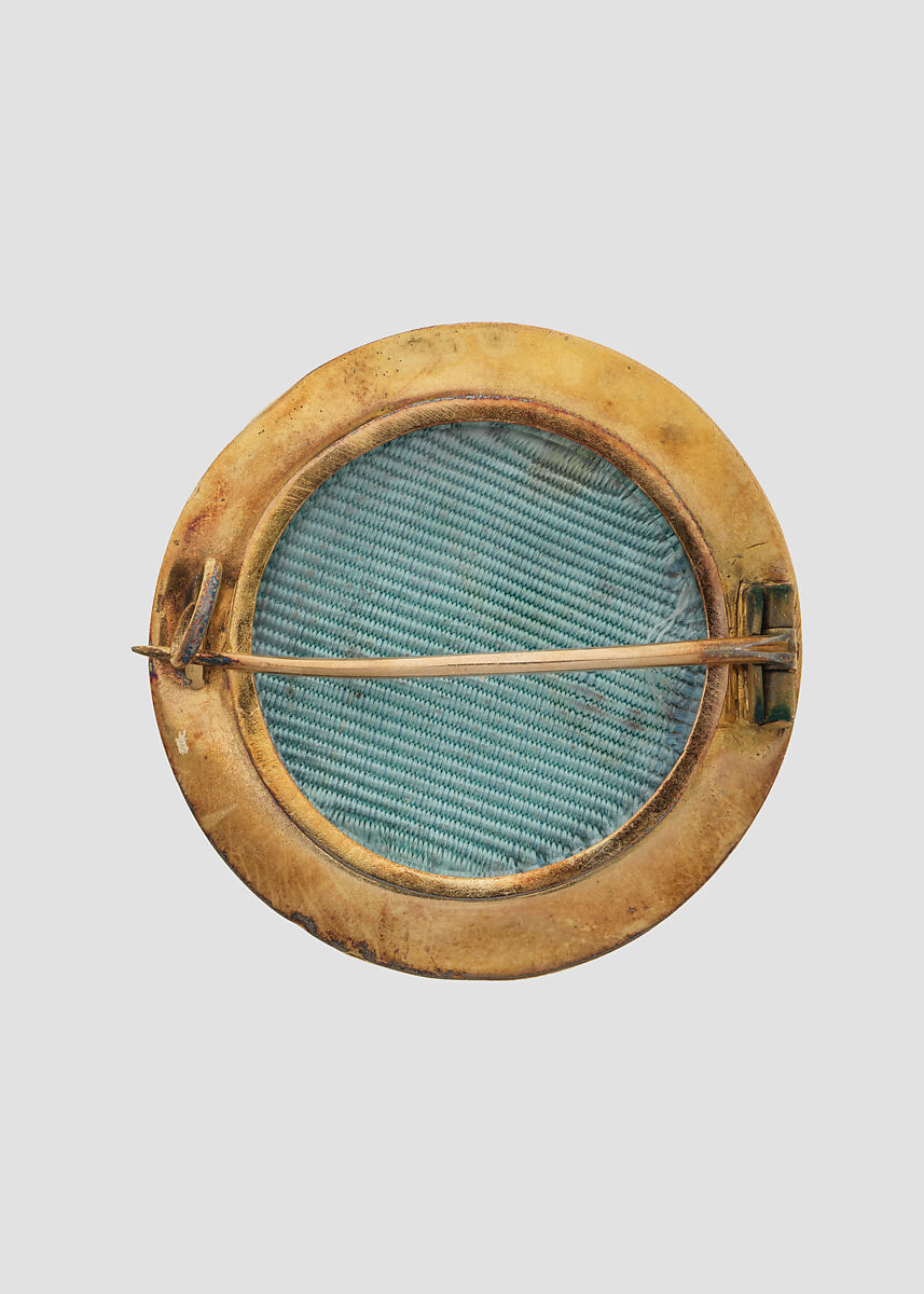 Brooch with Assyrian human-headed winged lion, Gold, enamel, British