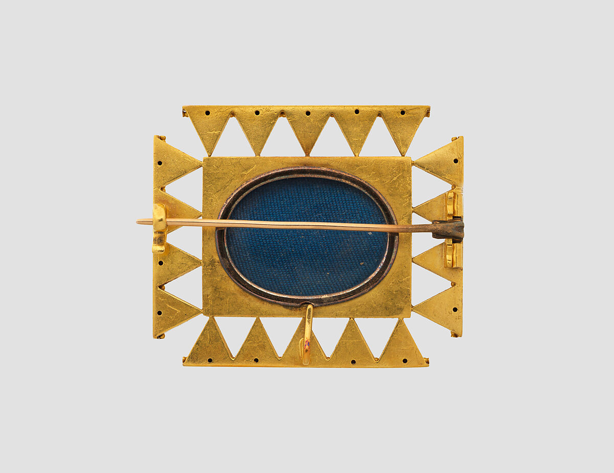 Brooch with Assyrian-inspired design, Gold, glass, British