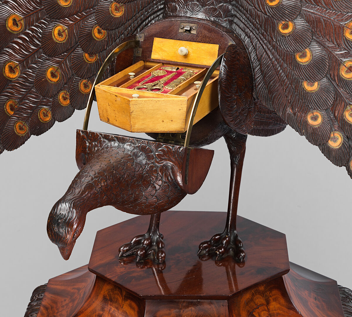 Work box in the form of a peacock, Mahogany, coniferous wood (pine?), oak; birch, boxwood, ebonized wood; inlay of sycamore, green stained holly, mahogany; bone, silver-gilt, blued steel, brass, velvet, printed paper, German, probably Berlin