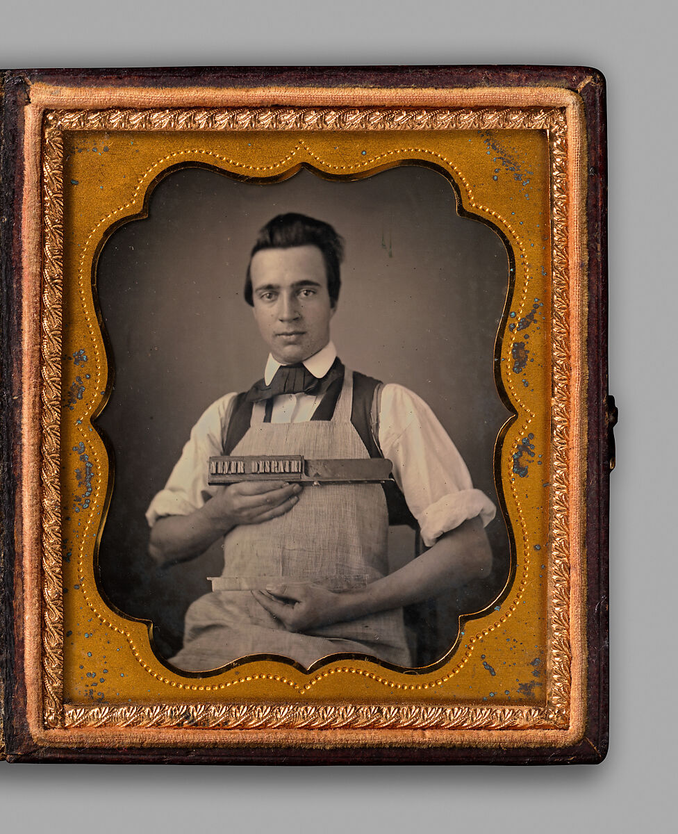 [Typesetter Holding Type Stick Spelling “NEVER DESPAIR!”], Unknown, Daguerreotype