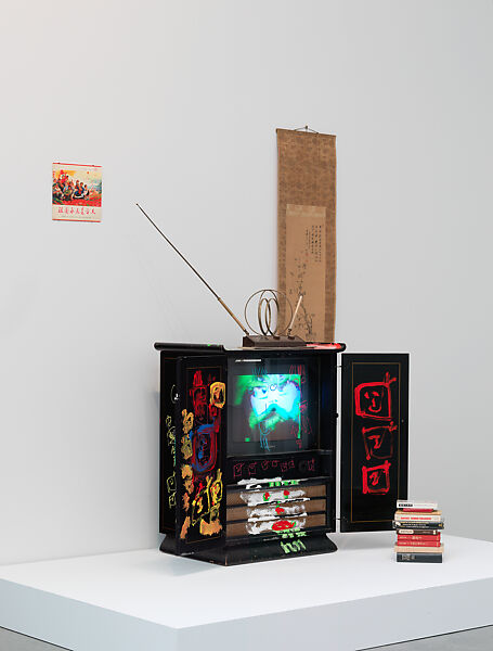 Chinese Memory, Nam June Paik (American (born Korea), Seoul 1932–2006 Miami, Florida), Single-channel video, color, silent, 21 min., 12 sec.; vintage television cabinet with permanent oil marker, glass, acrylic, record cover, scroll, antennae, and books