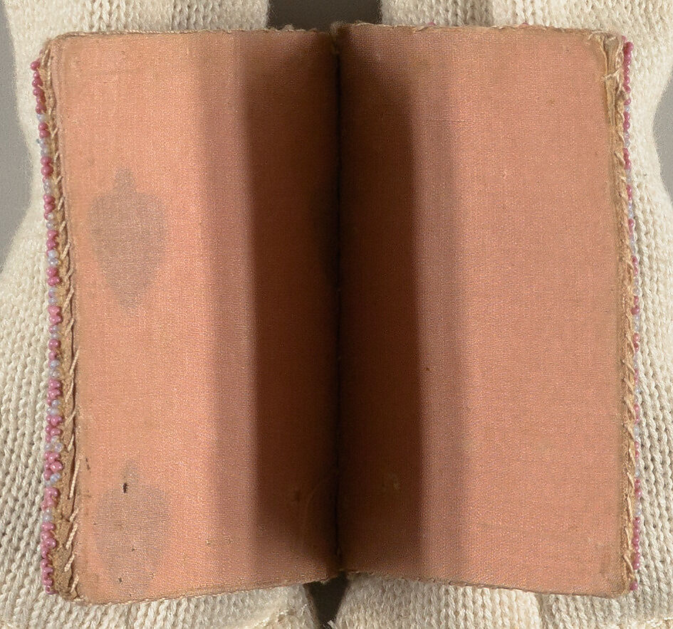 Needle case in book form, with the initials M.H.