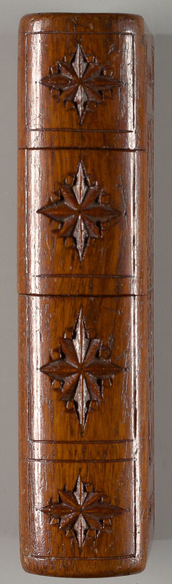 Carved wood puzzle box in book form