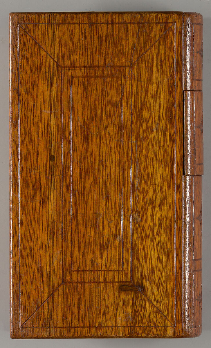 Carved wood puzzle box in book form