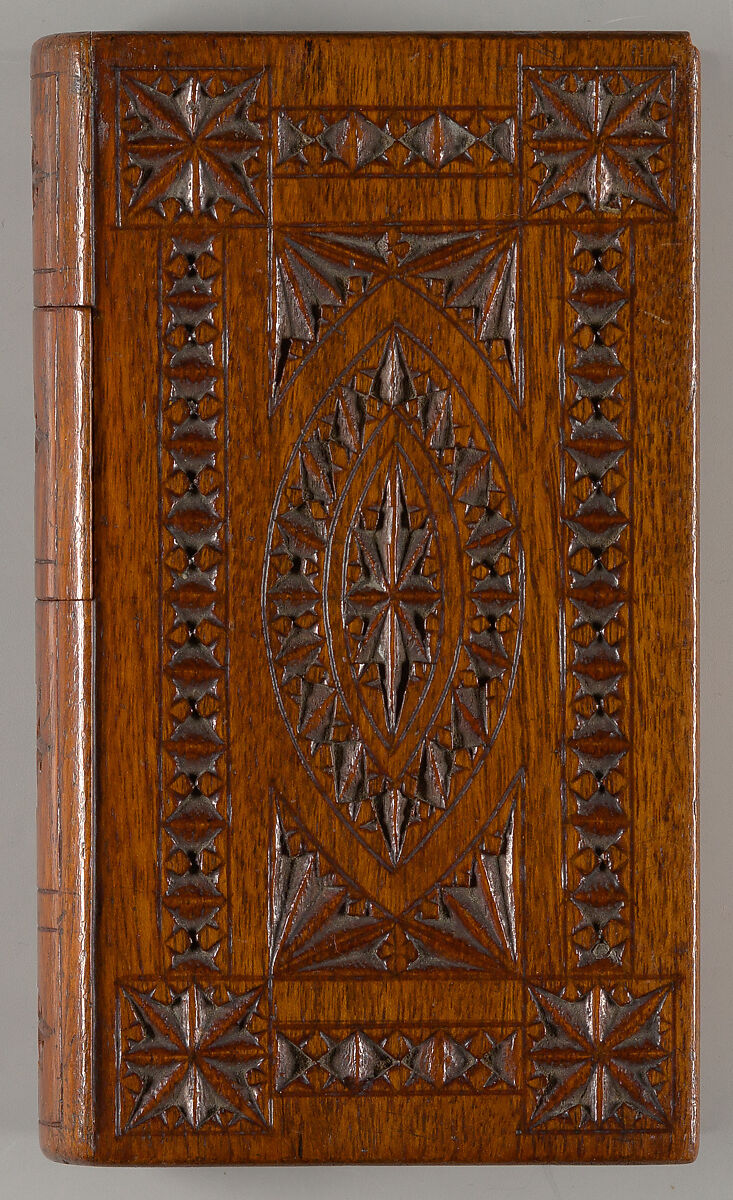 Carved wood puzzle box in book form