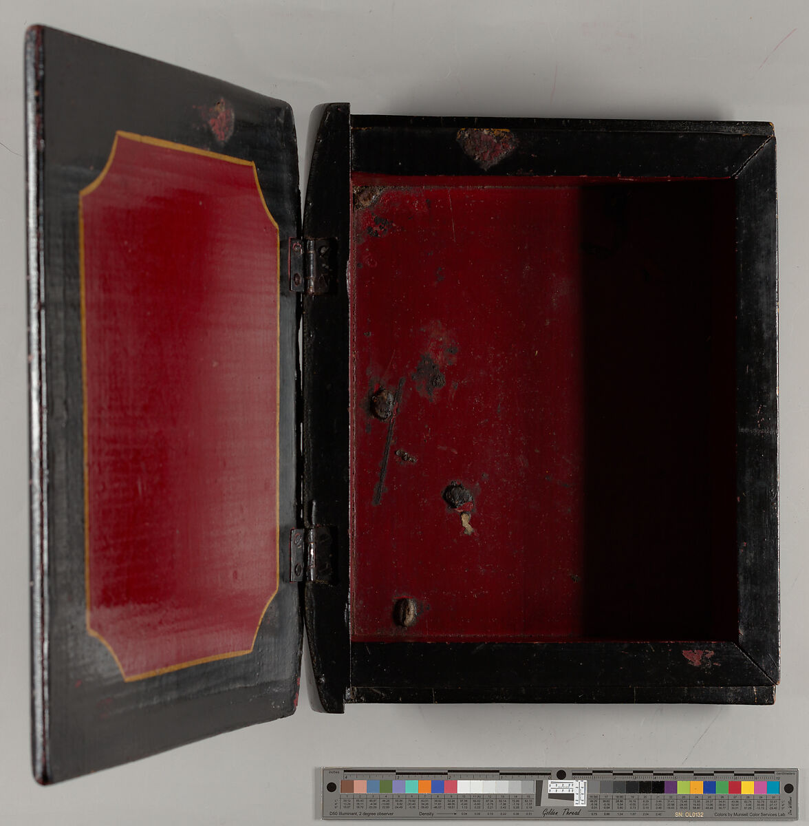 Desk or dresser box in book form, painted with the initial "T"