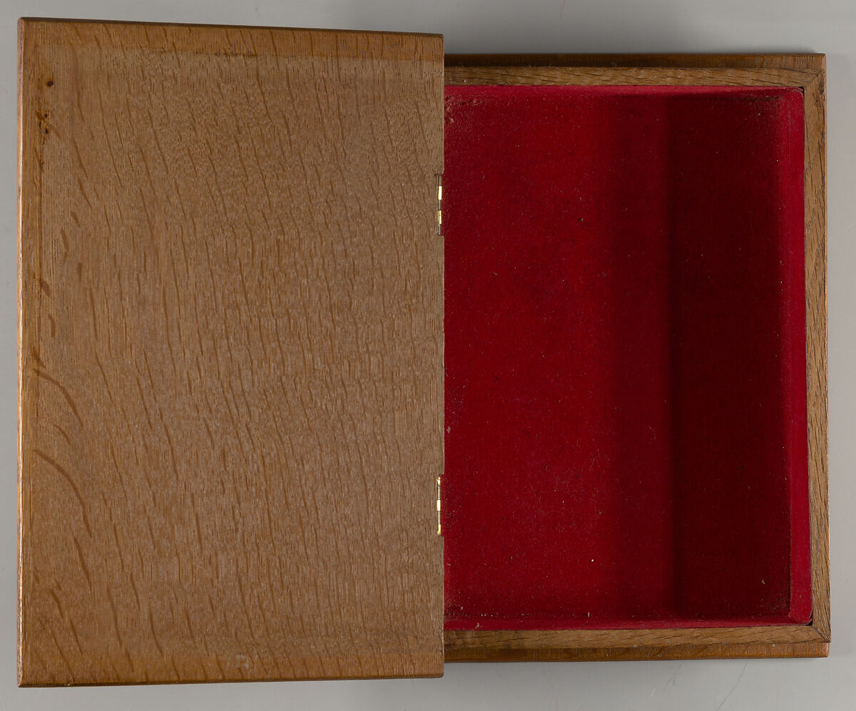 Box in book form, carved with roses