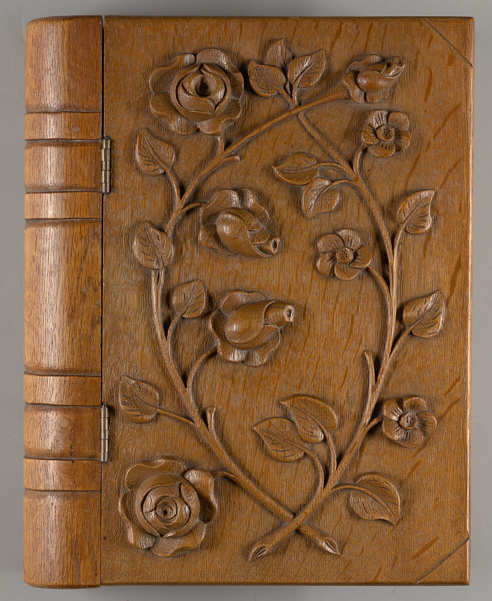 Box in book form, carved with roses 