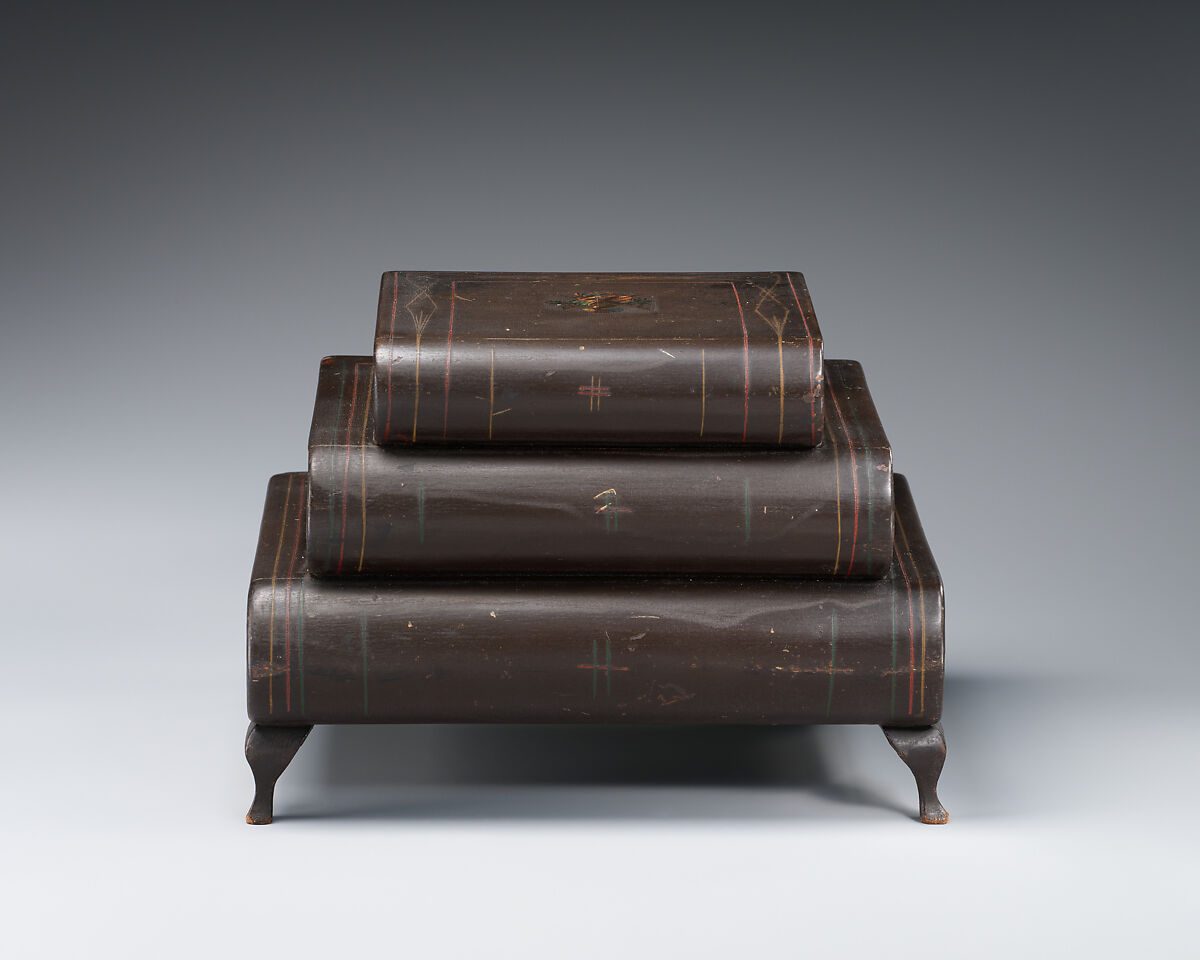 Graduated, three-tiered, footed box in book form