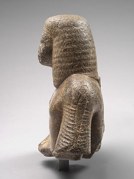 Bust of a dignitary, reinscribed with divine figures, Granodiorite