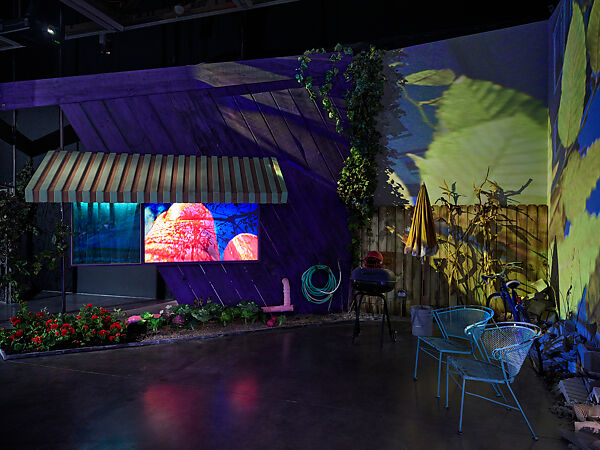 Neighbors Without Fences, Pipilotti Rist (Swiss, born Rheintal 1962), Eight-channel digital video installation, color, sound, durations variable; wood, paint, limestone, props
