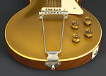 Les Paul Model Electric Guitar and Amplifier, Gibson (American, founded Kalamazoo, Michigan 1902), Neck/Head: Honduran Mahogany; Headstock Veneer: Painted holly; Headstock Decoration: Mother of Pearl; Truss Rod Cover: Plastic; Tuning Machines: Metal; Machine Head Buttons: Plastic; Nut: Bone?; Fingerboard: Brazilian Rosewood; Fret markers: Mother of Pearl; Frets: Nickel silver; Strings: Metal; FB Binding: Plastic; Pick up covers: Plastic; Vol/Tone knobs: Plastic; Soundboard/Top: Honduran Mahogany; Solid Body: Honduran Mahogany 
Binding: Plastic; 
Pickguard: Plastic; Bridge: Metal; Neck side strap button: Metal 
End strap button: Metal; Tailpiece: Metal, American