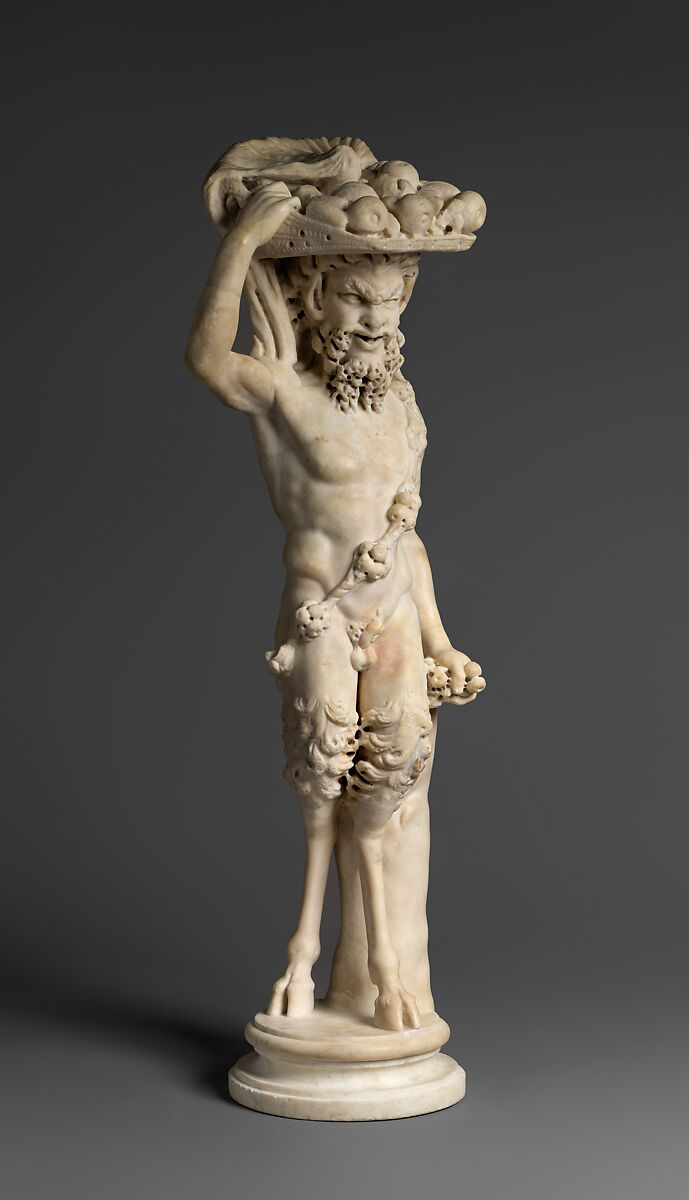 Marble statue of Pan/ Pan or Satyr with winnowing basket filled with offerings and cultic objects, Marble