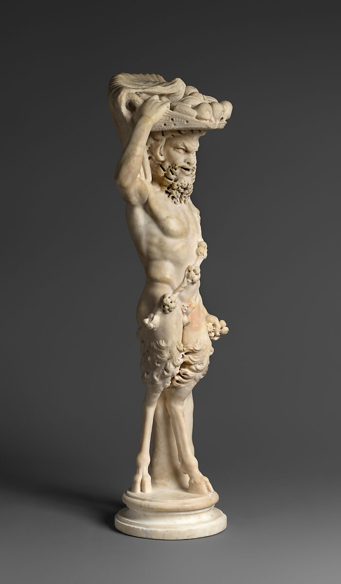 Marble statue of Pan/ Pan or Satyr with winnowing basket filled with offerings and cultic objects, Marble