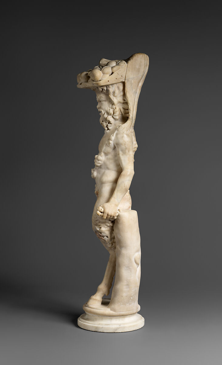 Marble statue of Pan/ Pan or Satyr with winnowing basket filled with offerings and cultic objects, Marble