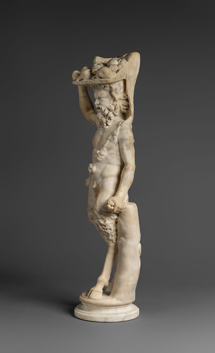 Marble statue of Pan/ Pan or Satyr with winnowing basket filled with offerings and cultic objects, Marble