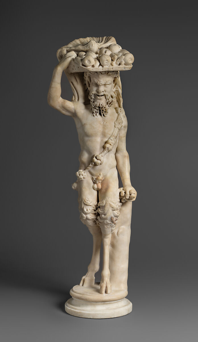 Marble statue of Pan/ Pan or Satyr with winnowing basket filled with offerings and cultic objects, Marble