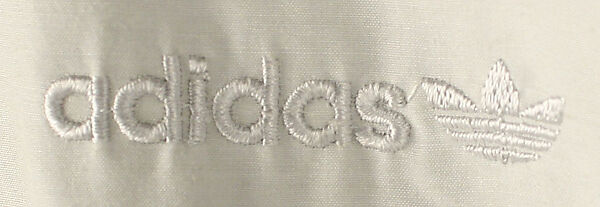 Athletic ensemble, (a,b) polyester/cotton
(c,d) leather, American