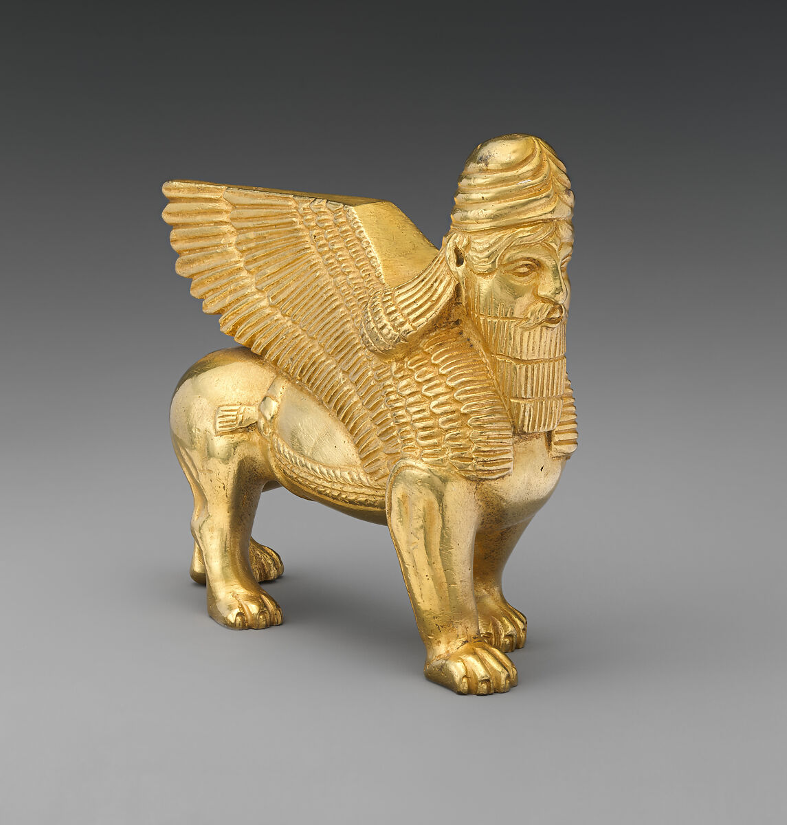 Human-headed winged bull and lion, Gilt bronze, British