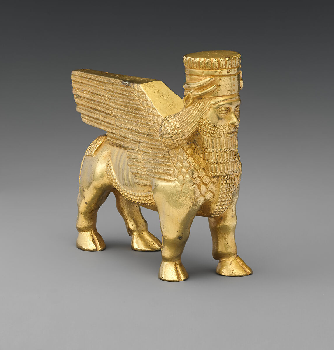 Human-headed winged bull and lion, Gilt bronze, British