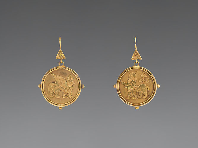 Earrings with Assyrian motifs