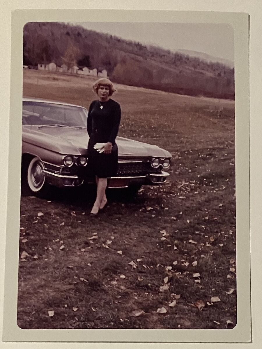 [Crossdresser by a car at Chevalier d'Eon], Unknown, Chromogenic print