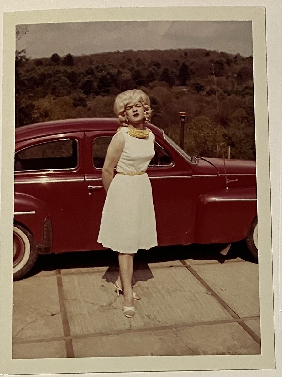 [Kate in front of red car at Chevalier d'Eon], Unknown, Chromogenic print