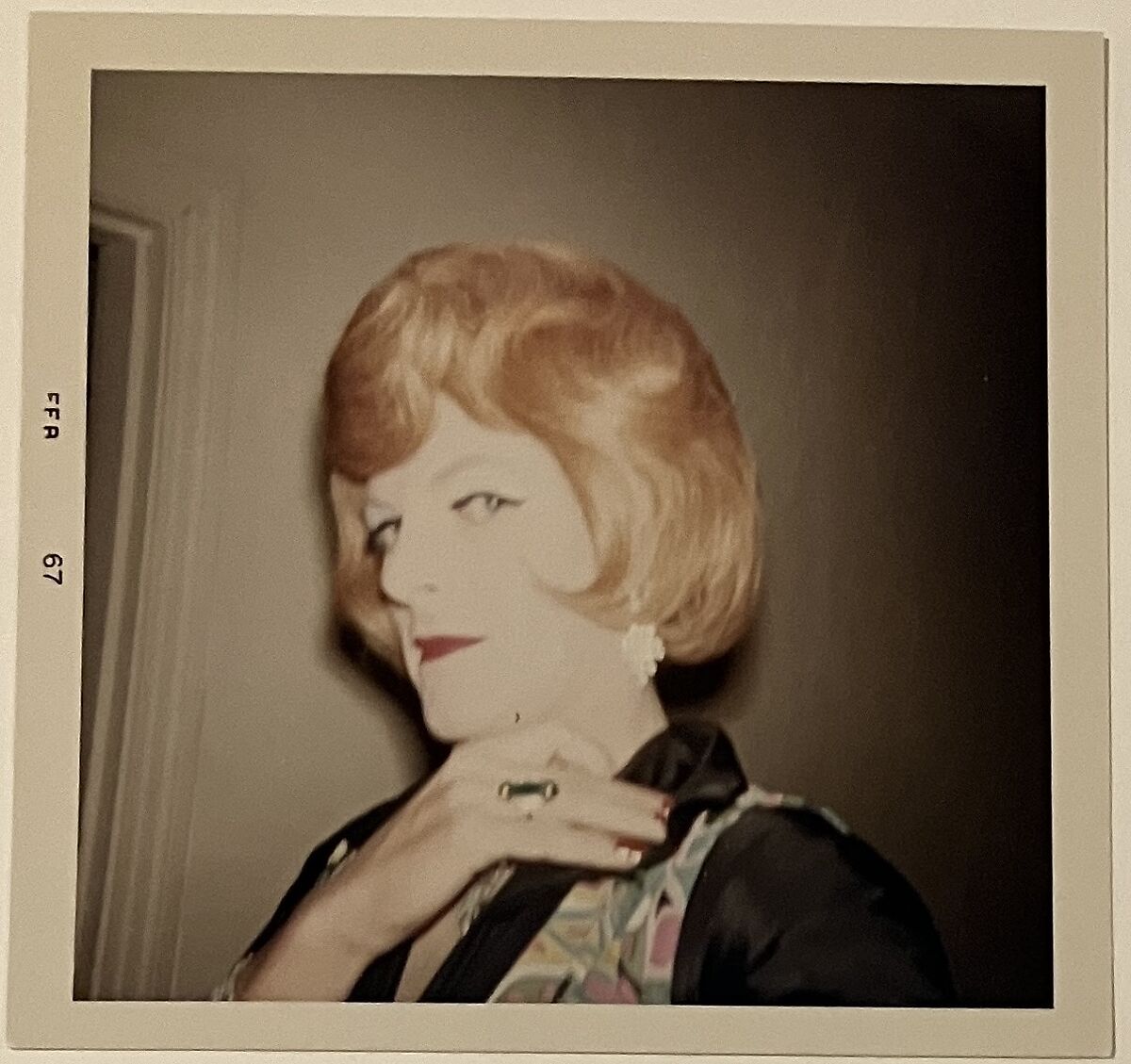[Crystal in auburn wig, profile, hand at collar], Unknown, Chromogenic print 