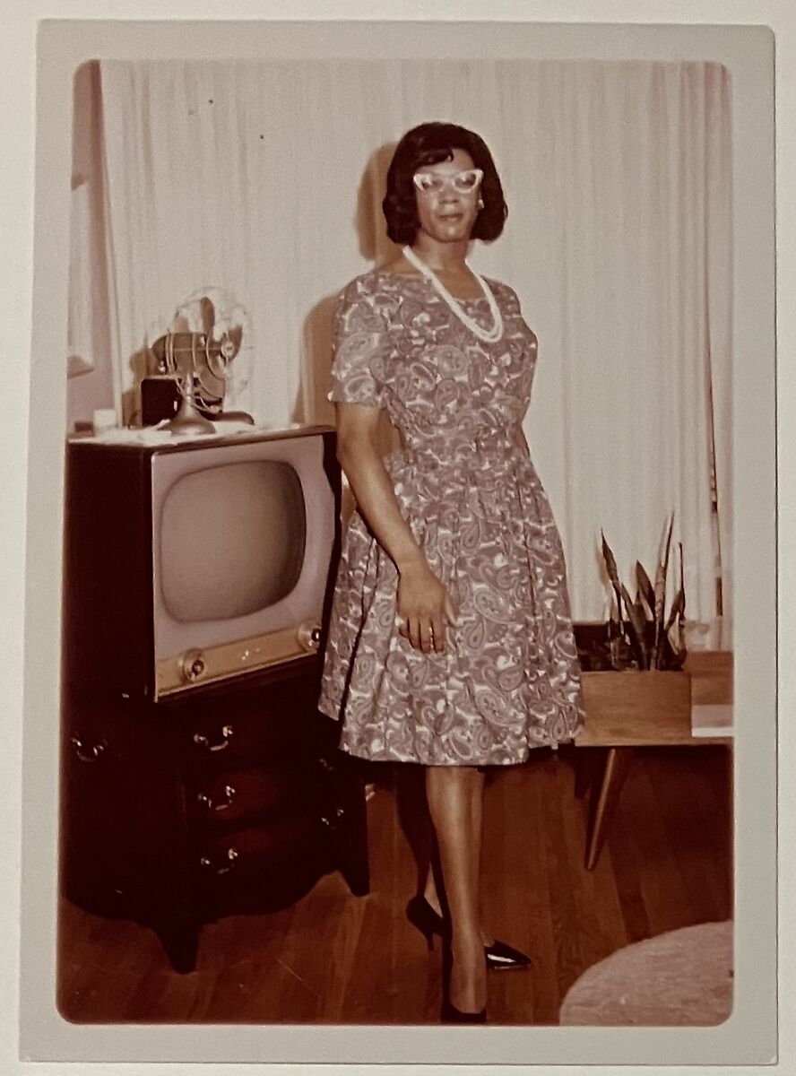 [Crossdresser in black and white paisley dress by TV], Unknown, Chromogenic print