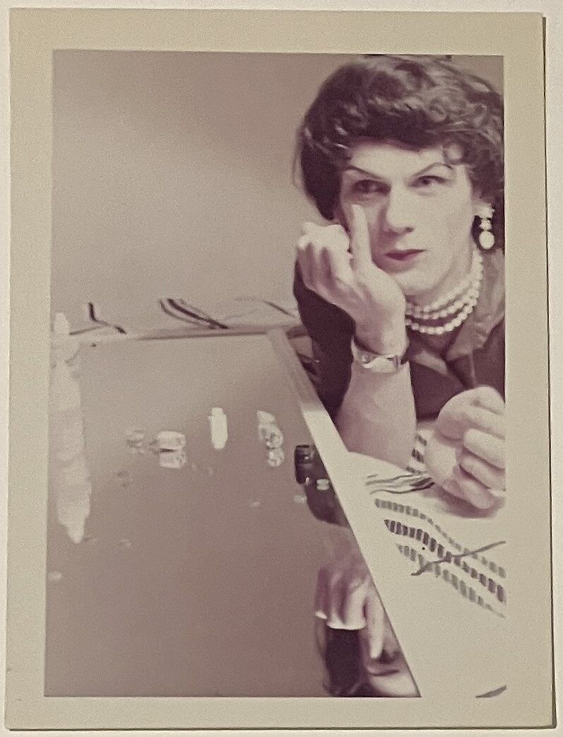 [Pegie putting in contact lens], Unknown, Chromogenic print