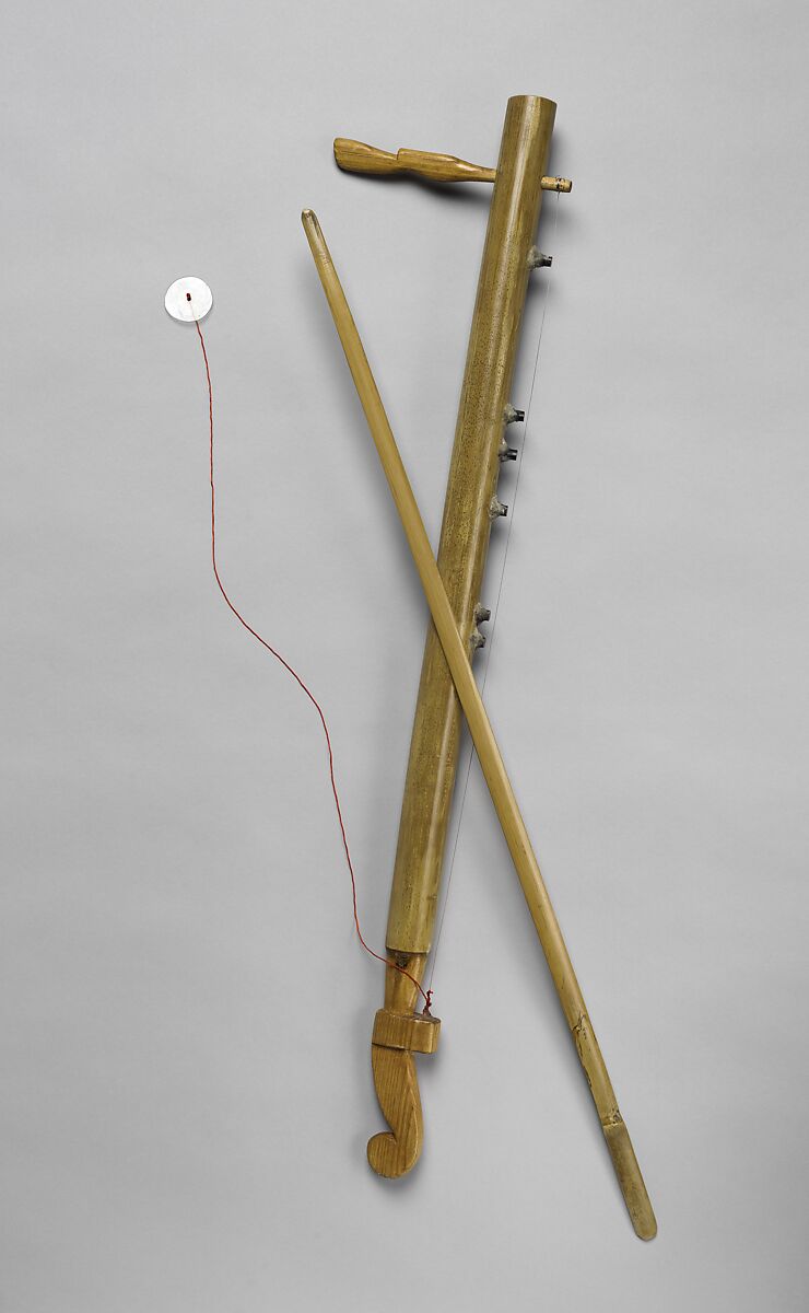 đàn K'ni, Quốc Hùng Nguyễn  Vietnamese, Bamboo for the body; Rosewood for the tuning peg & the base; Metal string for the string; Bamboo for the bows, Vietnamese