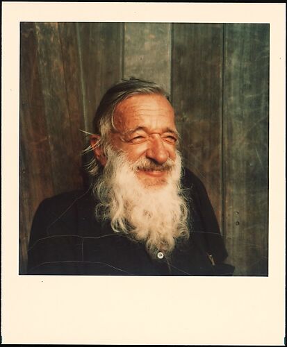 [Walker Evans Smiling in Front of Wood Fence]