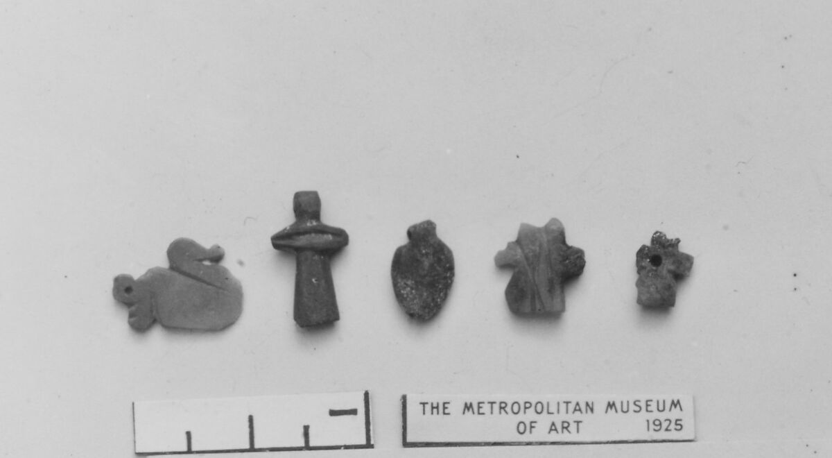 Group of five amulets, Glass, carnelia, lapis lazuli